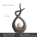 Modern grey ceramic abstract sculpture with circular hollow design and light center ball - Nordic Minimalist / Dark Grey (Tall)