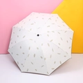 Foldable sun umbrella with cream fabric and golden brown leaf pattern and black vinyl coating - White Gold Leaf Feather