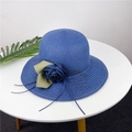 Close-up of dark blue straw sun hat with decorative fabric flower and green ribbon leaf - M (56-58cm) / Navy Blue
