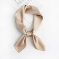 Close-up of champagne gold satin scarf with silk luster tied in an elegant bow knot - Khaki