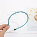Elegant thin headband featuring sparkling cyan blue rhinestones with black protective tips - Lake Blue