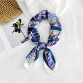 Blue and white tropical leaf silk scarf with orange borders on textured backdrop - Blue Banana Leaf