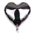Macro shot of a silver heart-shaped foil balloon with reflective metallic finish and texture - Silver