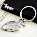 Detailed view of a silver fighter jet keychain made of polished metal on a desk - Jet Business Plane (飞机2)