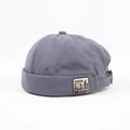 Dettaglio del cappello miki grigio-blu con toppa in denim e fibbia in metallo - Regolabile / Azzurro