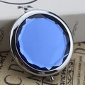 Round silver metal makeup mirror featuring a multifaceted blue crystal cover design - Crystal Royal Blue