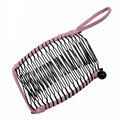 Detailed view of pink and black woven banana hair clip with elastic cord and side bead - 20 Teeth / Pink