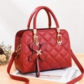 Red quilted leather handbag with diamond stitching and adjustable crossbody strap - Burgundy