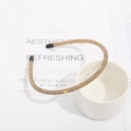 Elegant champagne gold headband with rhinestones resting on a white ceramic mug - Crystal Yellow