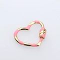 Detailed macro view of heart-shaped twisted link connector in pink and gold enamel finish - DM248-1 Heart Pink