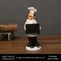 Vintage resin chef figurine holding a small blackboard for restaurant desk decor - Drawing Board Chef