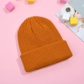Winter warm knitted beanie hat in vibrant ginger yellow with ribbed texture for adults - Orange