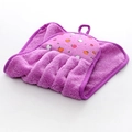 Detail showing soft purple coral fleece hand towel with hanging loop and fruit print - Purple