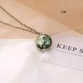 Detail of vintage bronze necklace featuring green glowing universe moon pendant texture - Luminous Moon Style (11#)