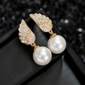Elegante S925 zilveren pareloorbellen met gouden engelenvleugels en AAA zirkoon - Goud Witte Parel