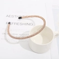 Elegant thin metal headband featuring pavé champagne rhinestones for a stylish hair look - Champagne