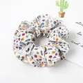 Macro detail of elastic fabric scrunchie featuring vintage floral pattern and soft texture - Off-white Flower