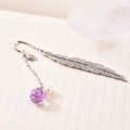 Silver metal feather bookmark with purple dried flower glass ball and pearl on book - Purple Gypsophila