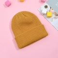 Winter thick knitted beanie in bright ginger yellow with a classic cuffed design - Turmeric