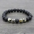 Lava rock yoga bracelet with spotted stones beads on gray wood background - Spotted Stone