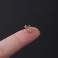 Pink zircon ear stud with gold-plated stainless steel setting held on finger - 1# Heart Openwork (Gold)