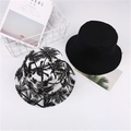 Détail du bob noir uni à côté d'un modèle avec imprimé de palmiers tropicaux - M(56-58cm) / Noir