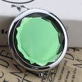 Compact round makeup mirror with green faceted gemstone lid and silver metal frame - Crystal Green