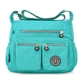 Waterproof nylon crossbody bag in teal blue with multiple pockets and adjustable strap - Emerald Green