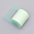 Light green sticky note dispenser with translucent holder and refillable paper roll - Green Dispenser