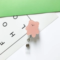 Detail of pink acrylic bear retractable badge holder with smooth finish and clip - Orange