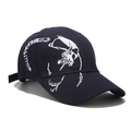 Close-up of intricate white skull embroidery on navy cotton canvas baseball cap fabric - Adjustable / Right Side Embroidery Navy Blue