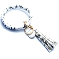 Detail view of white cactus leopard print bangle keychain with fringe tassel and gold rings - Black Cactus