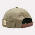 Detail of adjustable leather strap and N&H logo patch on canvas docker brimless hat - Adjustable / Green (NH Label)