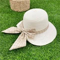 Beige straw sun hat with a brown plaid bow tie on green grass for summer vacation - M (56-58cm) / Creamy White