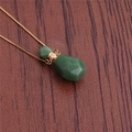 Green aventurine crystal flame perfume bottle pendant necklace with gold chain on wood - NSN0228 Green Aventurine