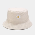 Detail of white daisy embroidery on beige canvas bucket hat with stitched brim texture - M (56-58cm) / Black and Beige Reversible