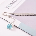 Silver metal feather bookmark featuring a blue dried flower glass ball and pearl pendant - Lake Blue Gypsophila