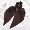 Close-up of a dark brown silk scrunchie with long ribbons on white satin background - Dark Brown