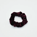 Detailed view of the soft velvet texture and pleats of the deep burgundy scrunchie - Burgundy