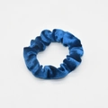 Close-up of high-elasticity blue velvet scrunchie showing soft textured fabric folds - Blue