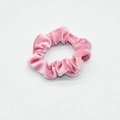 Detailed close-up of a premium pink velvet scrunchie showing soft fabric texture on white - Pink