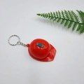 Red helmet keychain with integrated LED light and silver metal ring for keys - Red