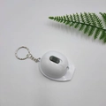 White helmet-shaped LED keychain with a silver metal ring and sliding switch - White