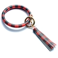 Close-up of red and black buffalo plaid bangle keychain with leather tassel and gold rings - Red Grid