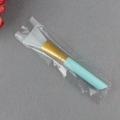 Silicone face mask brush with light blue handle and white flat head in transparent bag - Single Pack / Blue