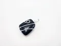 Detail of a wire-wrapped square black gemstone pendant with handcrafted silver winding - Silver Black Agate