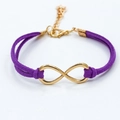 Fashionable purple suede infinity bracelet with golden metal symbol and lobster clasp - Purple