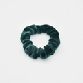 Close-up of a dark green velvet scrunchie showing plush texture and elastic hair band - Dark Green