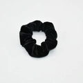 Detail of black velvet scrunchie with subtle glitter on a clean white background - Black (Glitter)