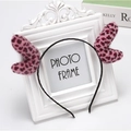 Pink leopard print plush deer ears headband on a white decorative frame stand - Ear Style / Pink Leopard
